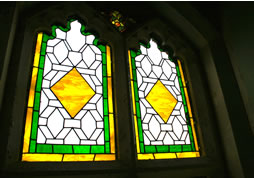 Traditional stone buildings can be enhanced by a  stained glass window by Deko Studio